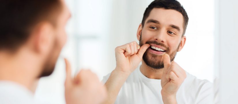 how do you floss with a dental bridge